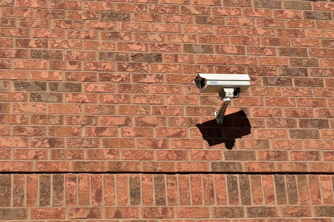 CCTV security camera mounted on the outside wall of a home.